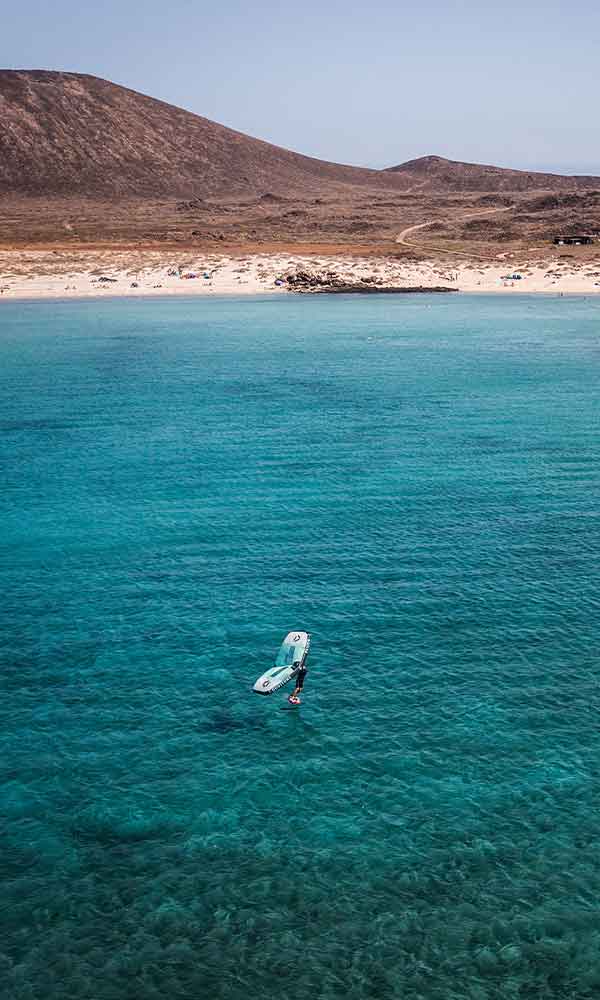 Practicing kitesurf in the Canary Islands enjoying a kitefari Trip