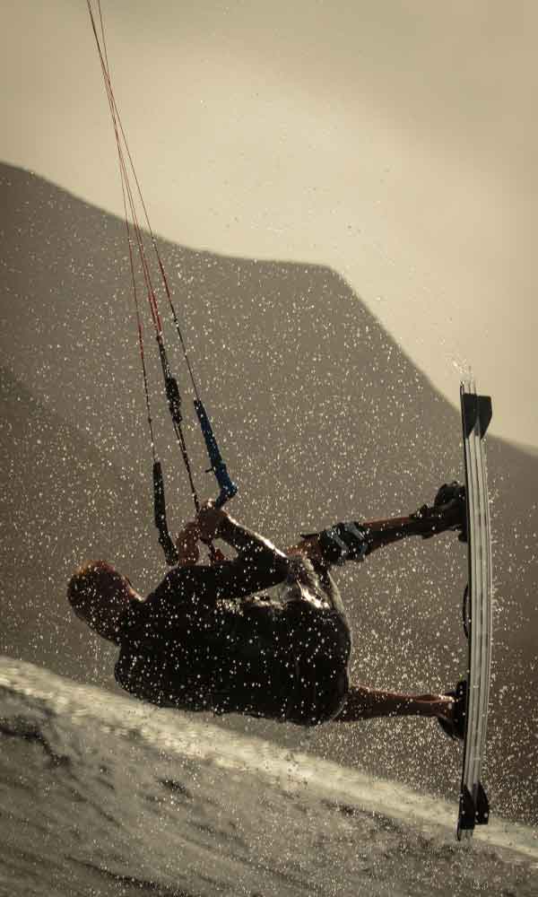 Practicing kitesurf in the Canary Islands enjoying a kitefari Trip